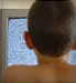 boy sitting in front of tv
