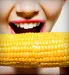 woman biting corn