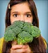 girl holding broccoli