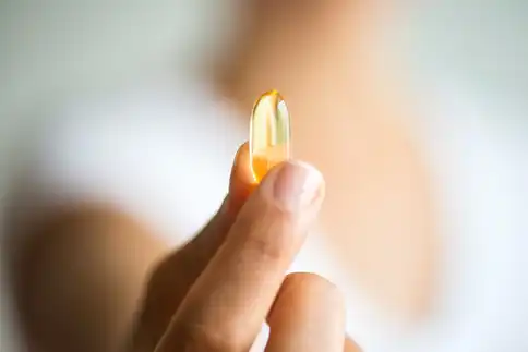 photo of lifestyle capsule pill hand