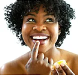 woman using lip balm