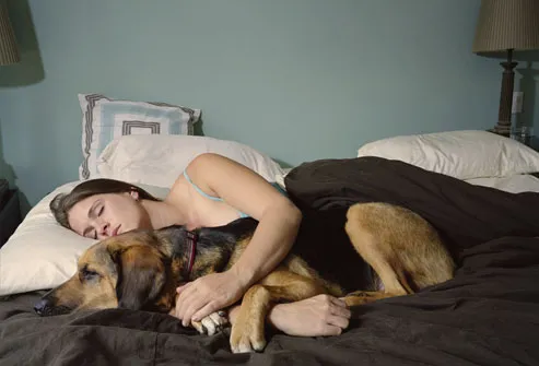 http://img.webmd.com/dtmcms/live/webmd/consumer_assets/site_images/articles/health_tools/12_Lifestyle_Tips_to_Avoid_Diabetes_Complications/getty_rm_photo_of_woman_sleeping_with_dog.jpg