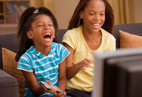 [Image: getty_rf_photo_of_two_girls_laughing_at_television.jpg]