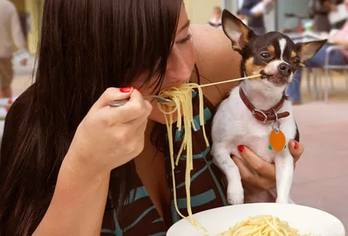 getty_rm_woman_sharing_pasta_with_dog_EDIT.jpg