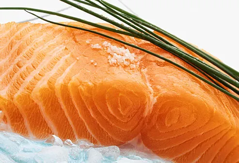 Skinned salmon fillet on crushed ice with chives