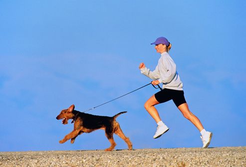 Woman Jogging With Dog