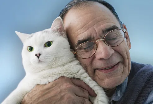 Older Man Hugging Cat