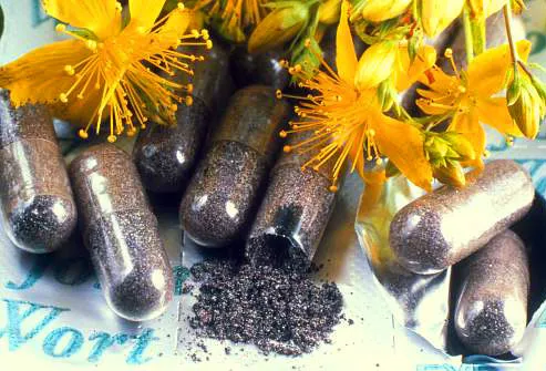Pills and flowers of St John's wort