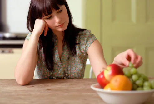 http://img.webmd.com/dtmcms/live/webmd/consumer_assets/site_images/articles/health_tools/depression_overview_slideshow/getty_rm_photo_of_woman_picking_at_food.jpg