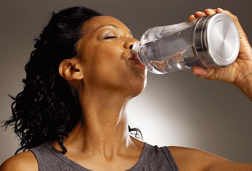http://img.webmd.com/dtmcms/live/webmd/consumer_assets/site_images/articles/health_tools/dry_mouth_causes/getty_rf_photo_african_american_woman_drinking_water.jpg