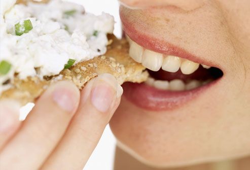 http://img.webmd.com/dtmcms/live/webmd/consumer_assets/site_images/articles/health_tools/embarrassing_beauty_questions_slideshow/getty_rf_photo_of_woman_eating_cracker.jpg