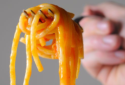 spaghetti with marinara sauce on a fork