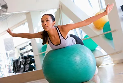woman balancing on exercise ball