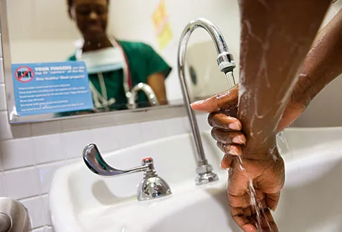 Doctor washing hands after seeing patient