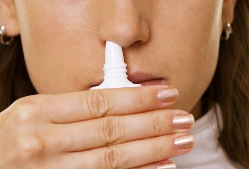 Woman Using Prescription Nasal Spray