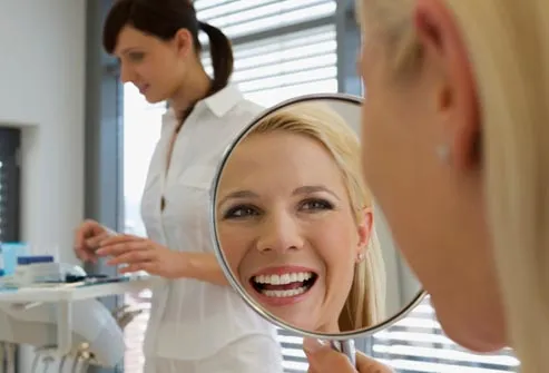 smiling woman at dentist office