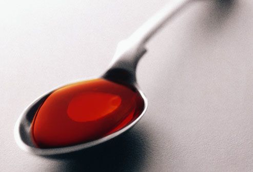 Orange Medicine in Spoon