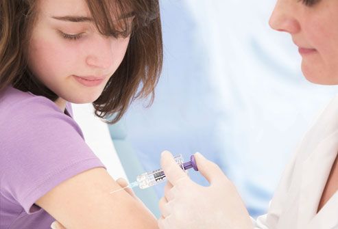 Nurse Immunizing Patient Against Cervical Cancer