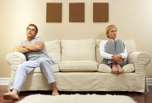 Arguing couple on sofa