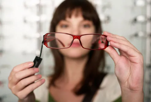 Woman Looking Through Glasses