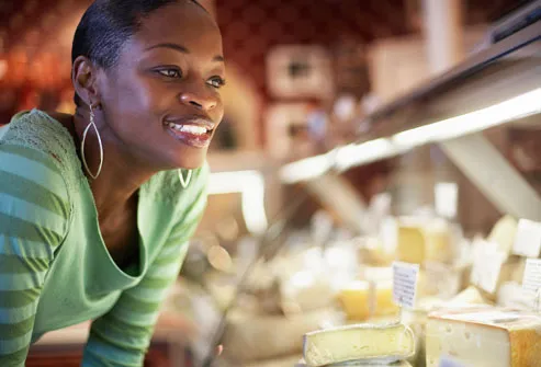 Woman looking at cheese display