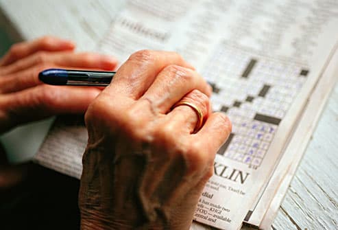 senior woman doing crossword