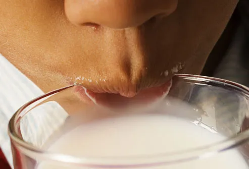 Close Up of Child Drinking Milk