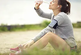 woman jogger drinking water