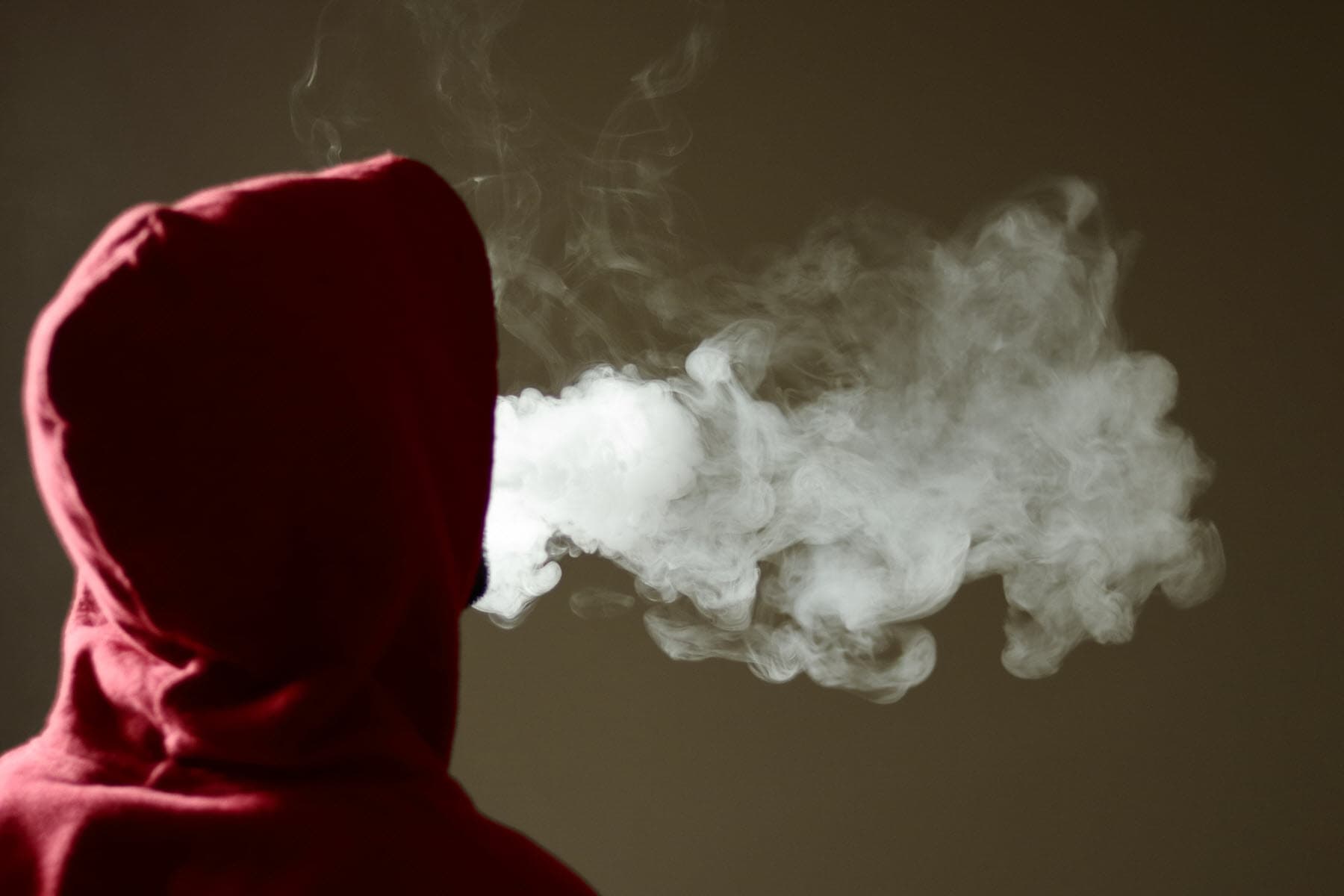 person successful  hoodie vaping