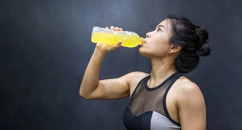 woman drinking sports drink