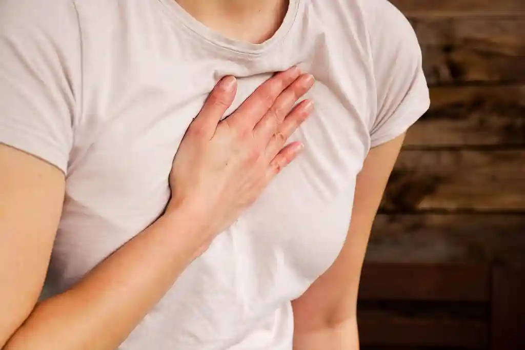 photo of woman experiencing chest pain
