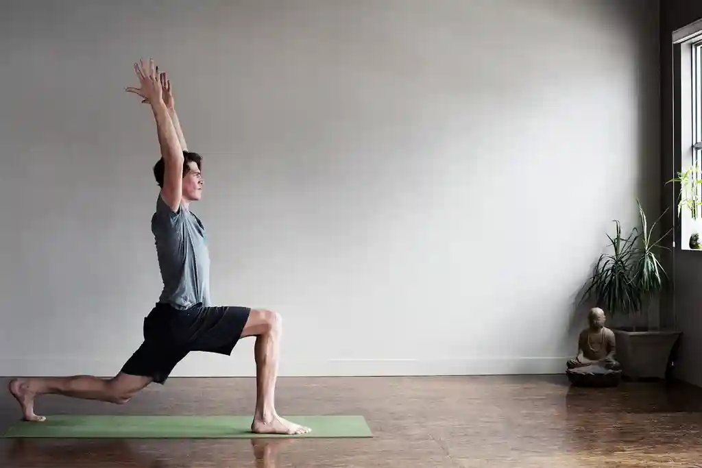 photo of male yoga instructor holding pose