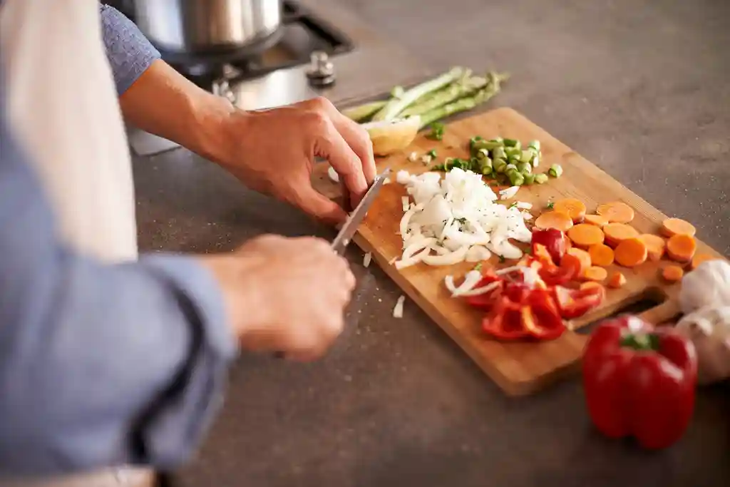 photo of man chopping vegetables