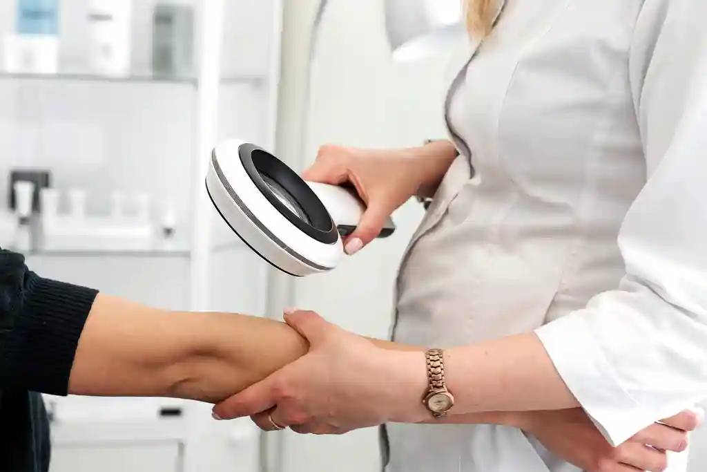 photo of dermatologist examining patient's arm