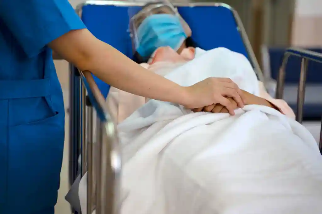 photo of woman on hospital bed
