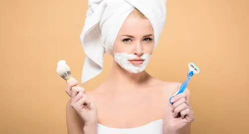 woman shaving face