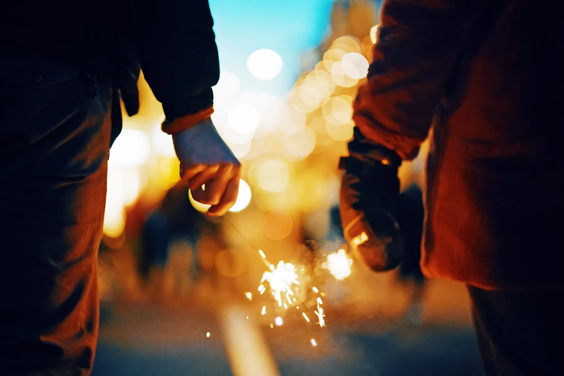 photo of couple with sparklers celebrating holiday