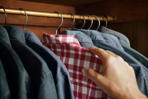 photo of checked shirt being selected close-up