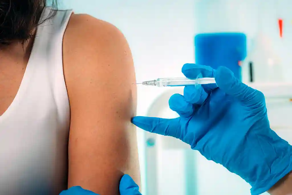 photo of woman being vaccinated