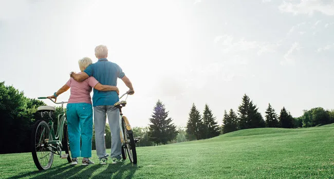 mature couple looking out onto field