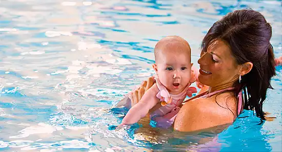 mother and baby in pool