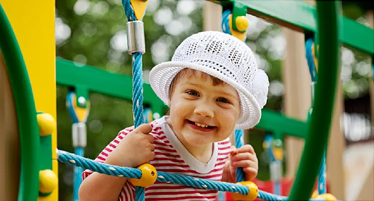 Happy two-year child in playground area