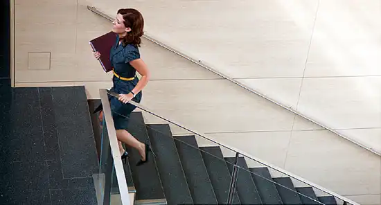 woman walking up stairs