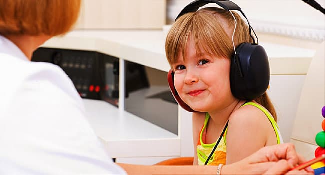 child with audiologist