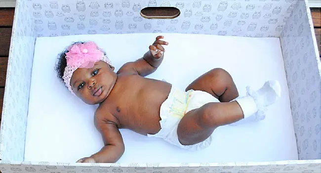 black female baby in crib