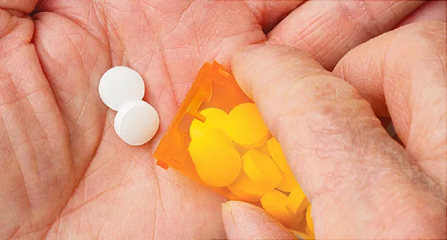 prescription pills in hand