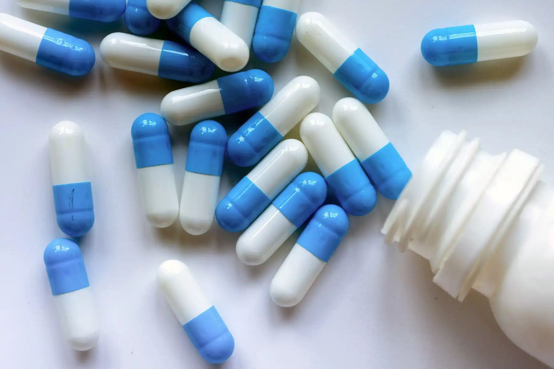 photo of blue and white capsules
