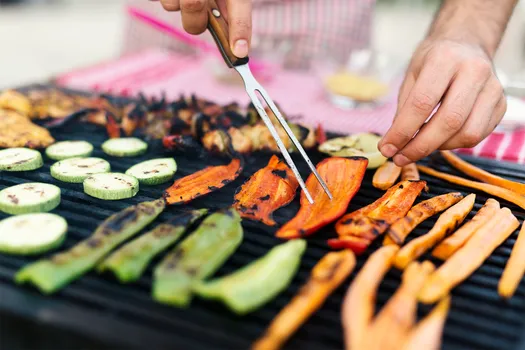 photo of vegetables and meat on the grill