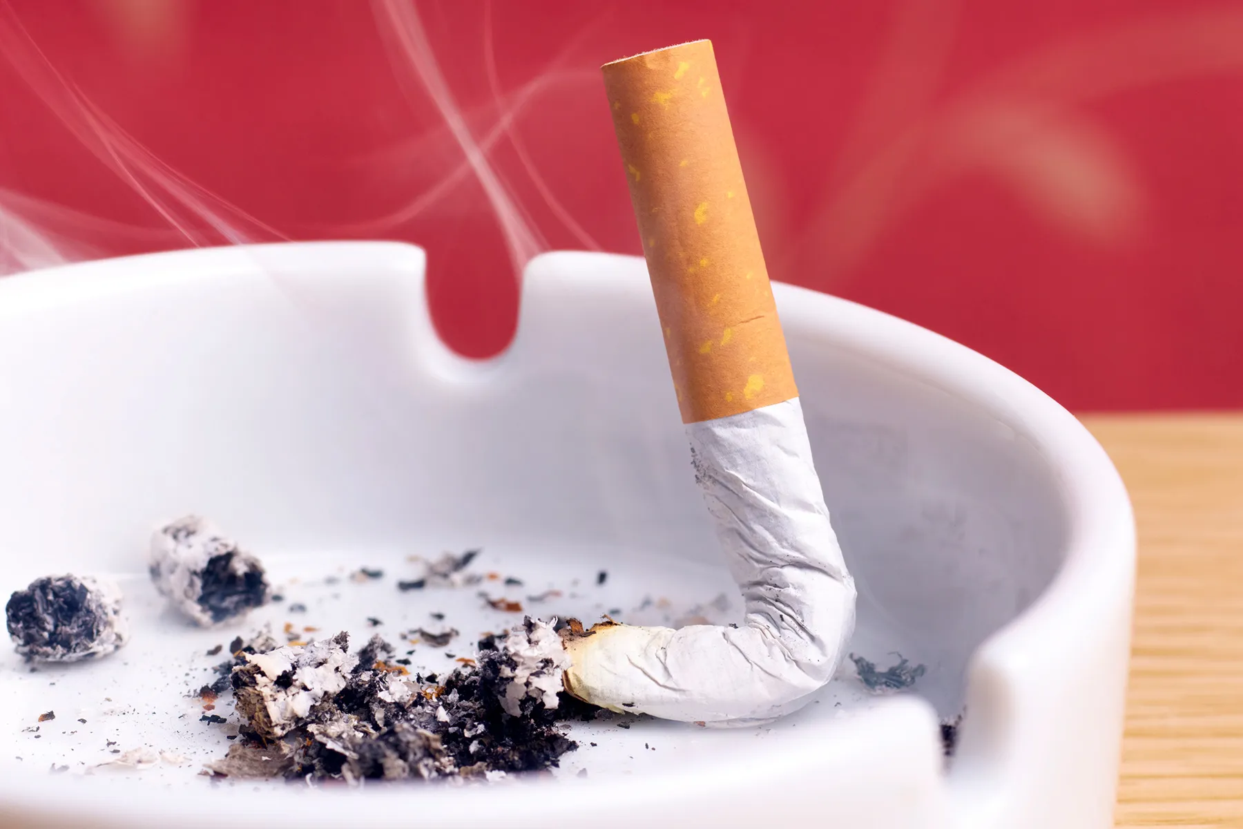 photo of cigarette butt in ashtray