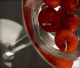 close-up of cherries in a martini glass